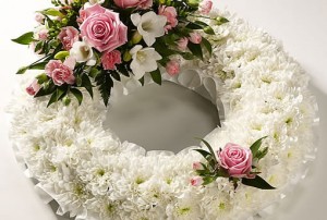 White and pink round funeral wreath flower