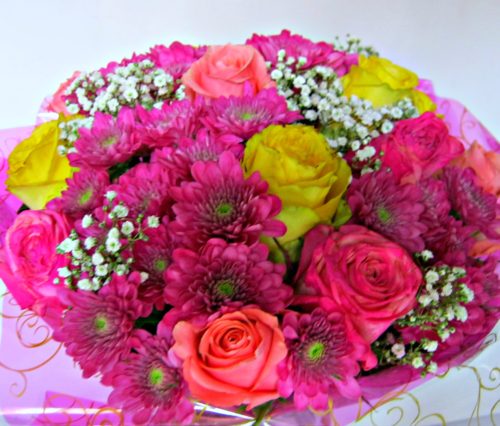 A bouquet of roses and chrysanthemums