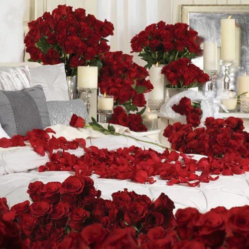 bedroom decorated with roses,rose petals and candles
