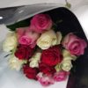 white,pink and red roses hand tied and wrapped in cellophane
