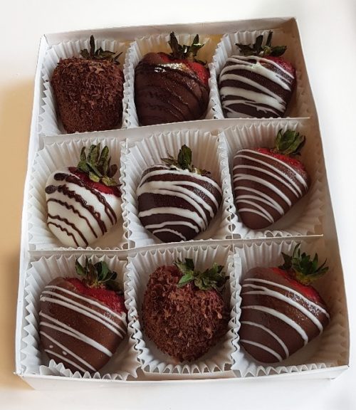 9 chocolate dipped strawberries in a box