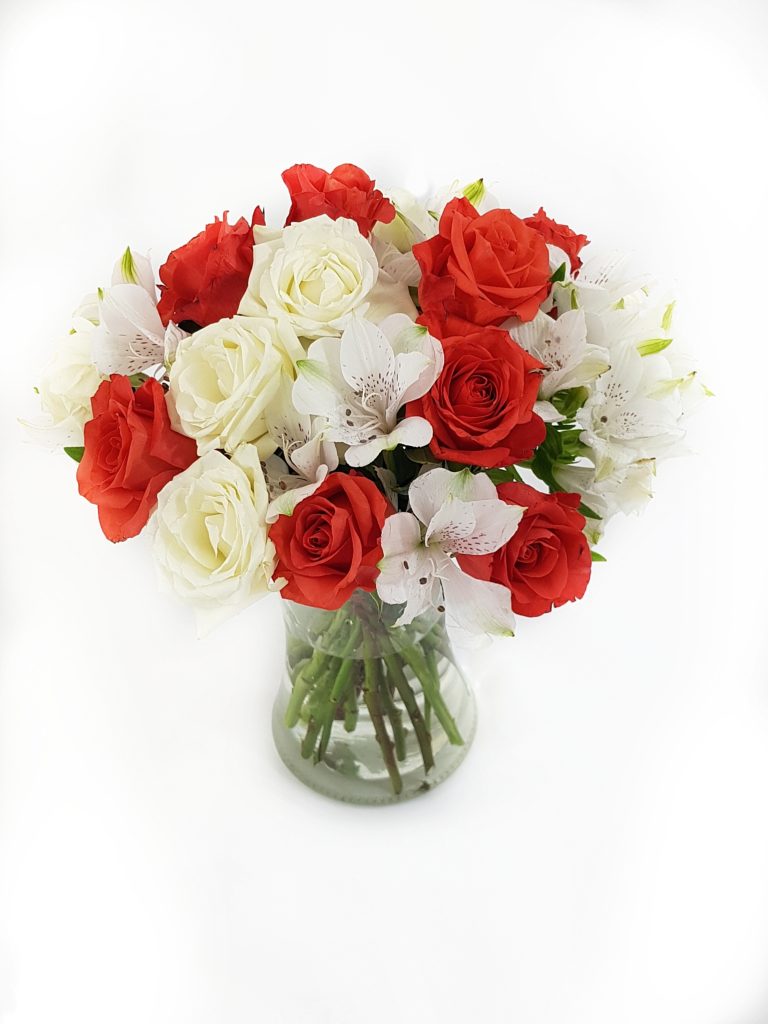 vase with red and white flowers