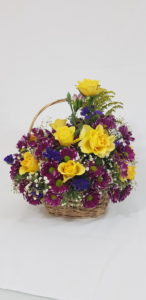flower basket- A basket of flowers with a variety of mixed blooms