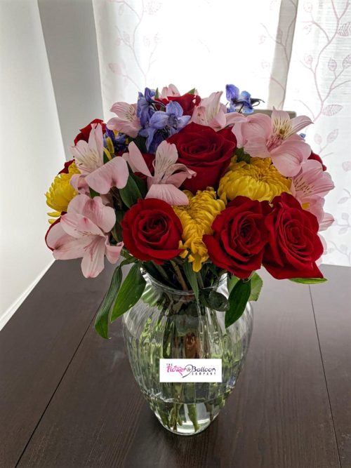 Mixed flowers in a vase on a table
